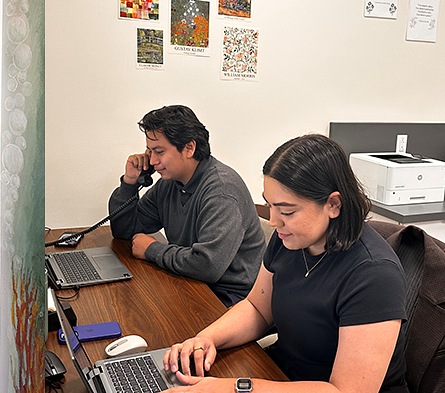 two interns answering phone